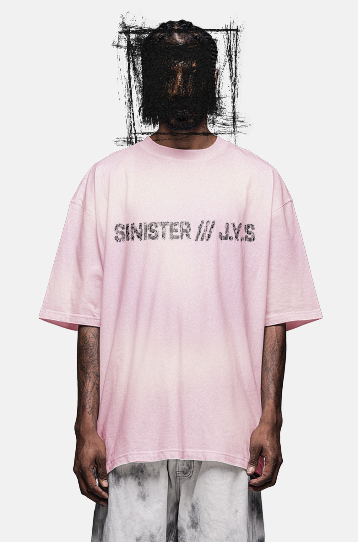 Person wearing a pink t-shirt with 'Sinister JYS' text on a white background