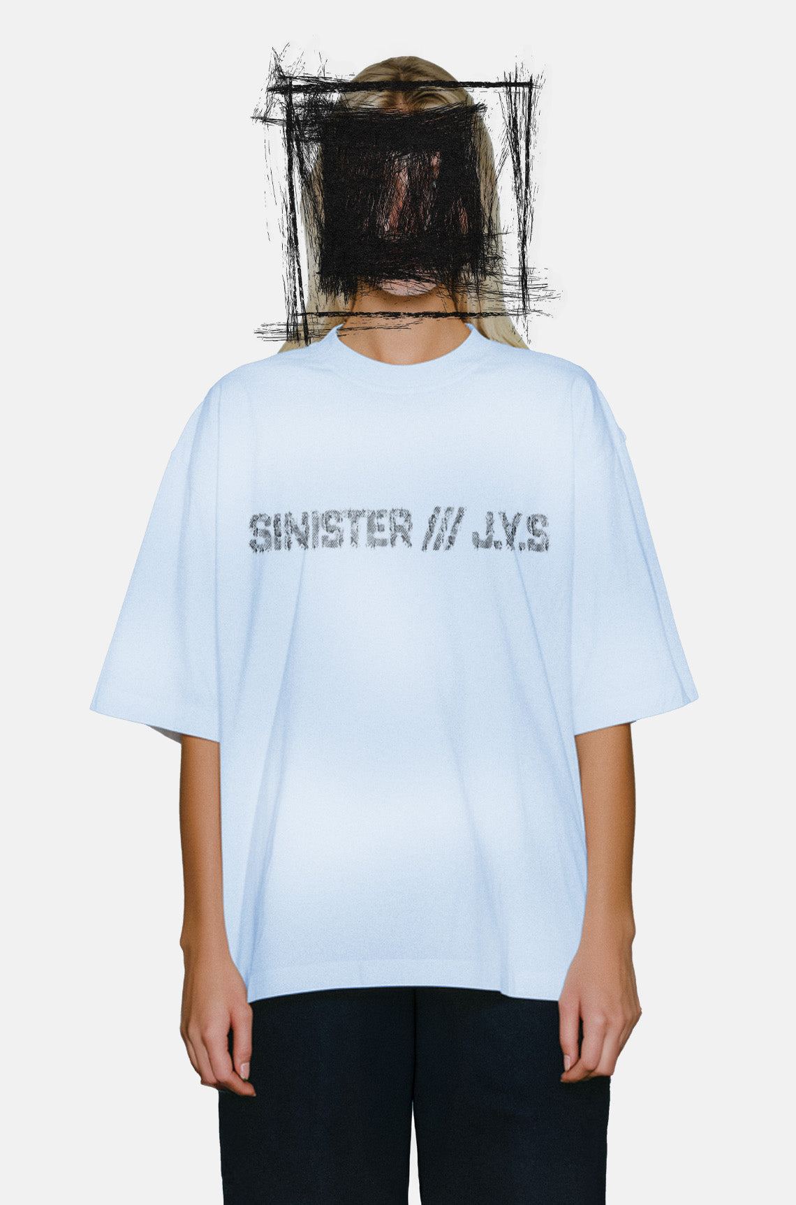 Person wearing a light blue t-shirt with text on a white background